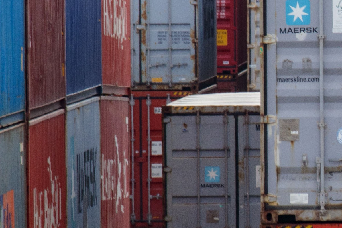 Rows of ocean freight containers at a port, illustrating containerized shipping options